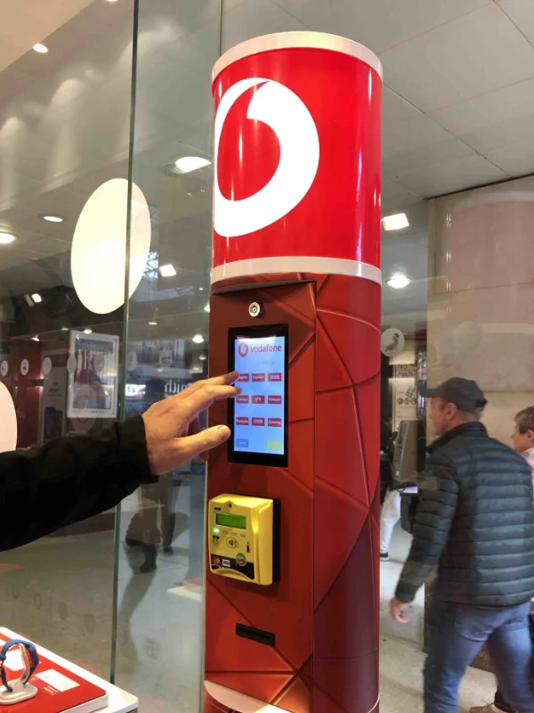 A branded SIM Vending Tubular System in Vodafone red